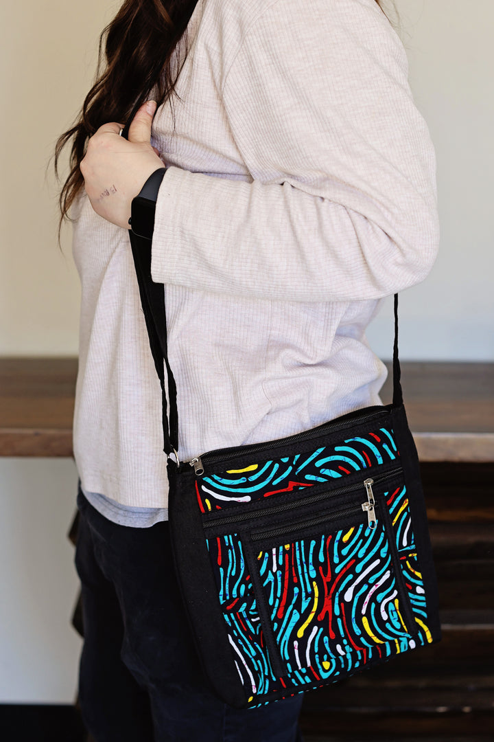 African fabric crossbody bag in assorted prints handmade by artisans