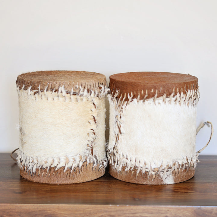 Artisan made African drum with natural wood and goat skin drumheads.