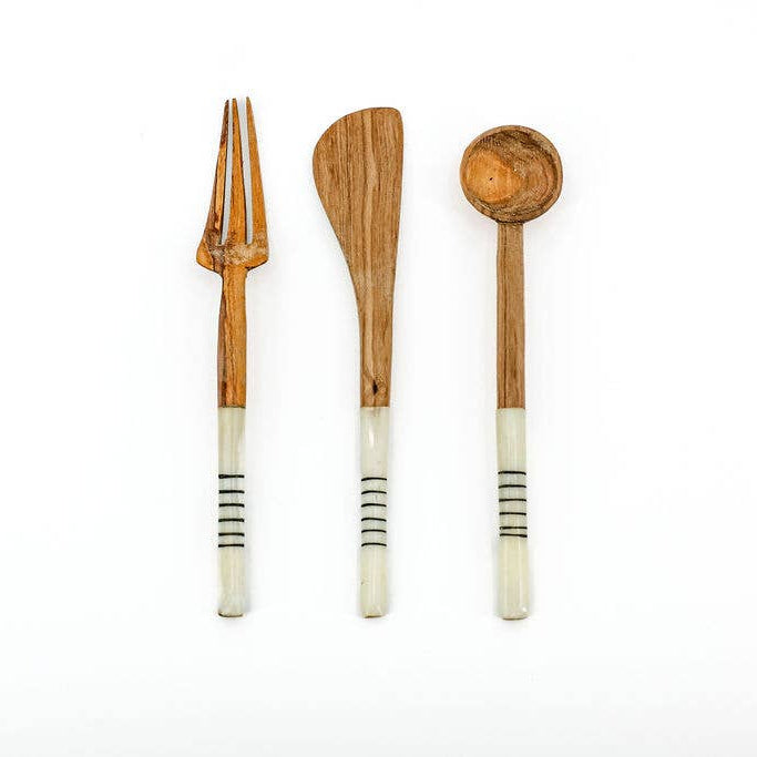 Hand-carved bone and wood serving utensils ethically made using natural materials.