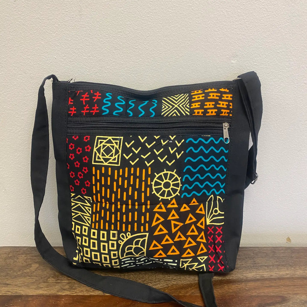 Back view of our recycled fabric travel pouch with zipper pockets, handmade in Kenya.