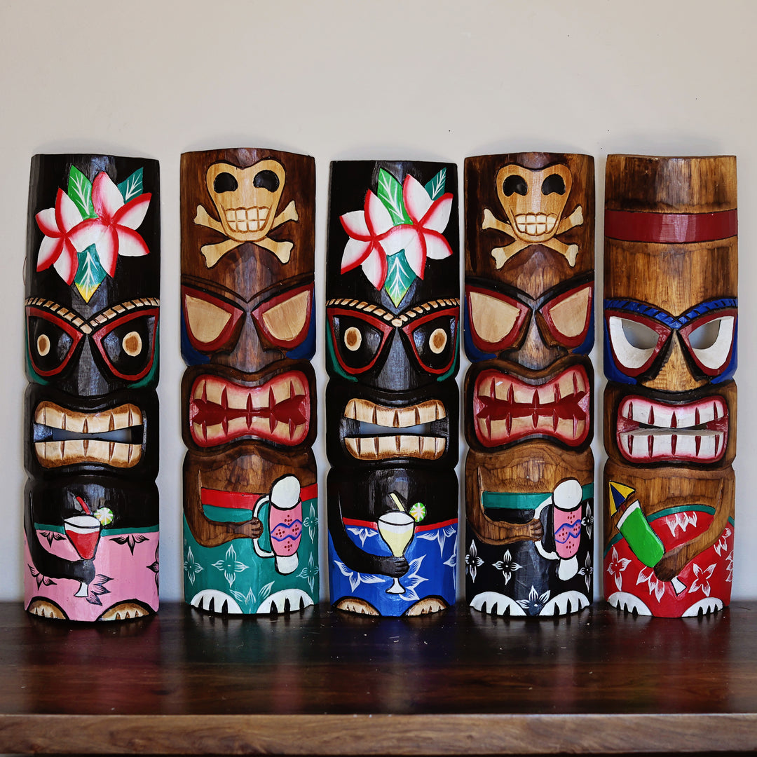 Carved bamboo tiki mask with tribal inspired design for wall display