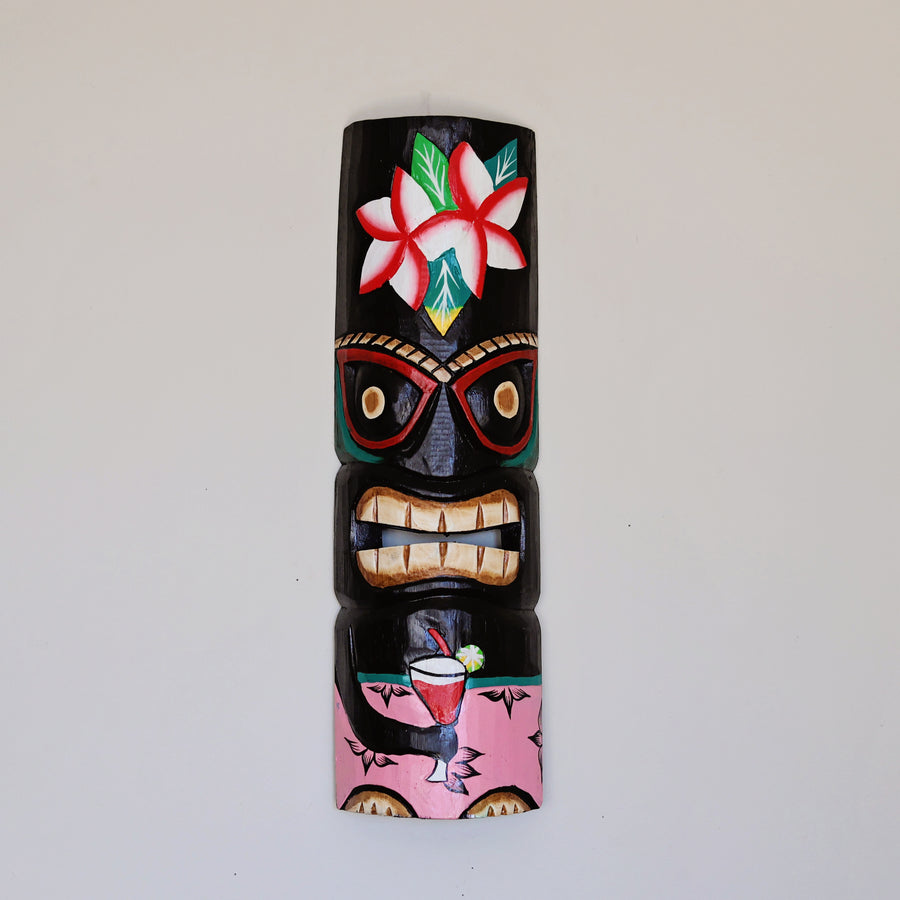 Hand carved bamboo tiki mask used as fair trade wall decor
