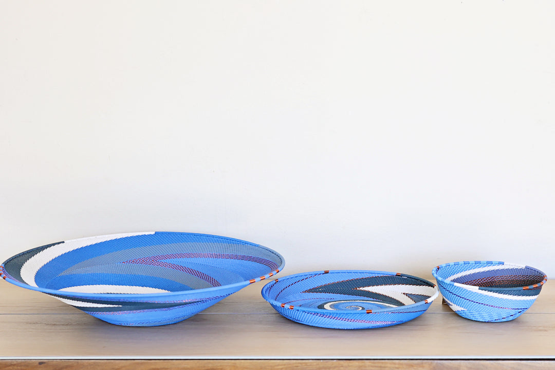 Medium Beach Zulu wire platter featuring an intricate blue, navy and white handwoven spiral design.