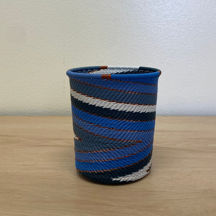 Wide base cup Beach Zulu wire bowl handwoven in South Africa in bright blue, navy, periwinkle and white.
