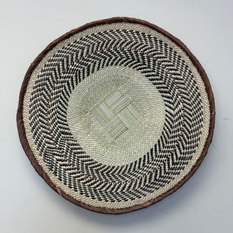 Binga basket bowl with geometric pattern handwoven by BaTonga artisans in Zimbabwe.