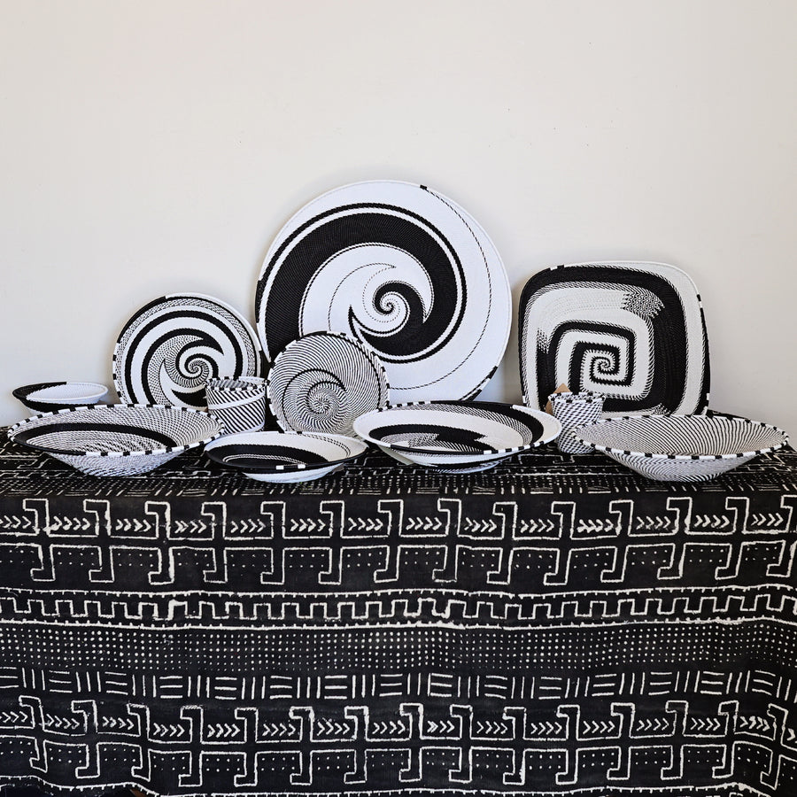 Collection of the Black & White Zulu baskets featuring intricate handwoven wire craftsmanship in a timeless black and white pattern.