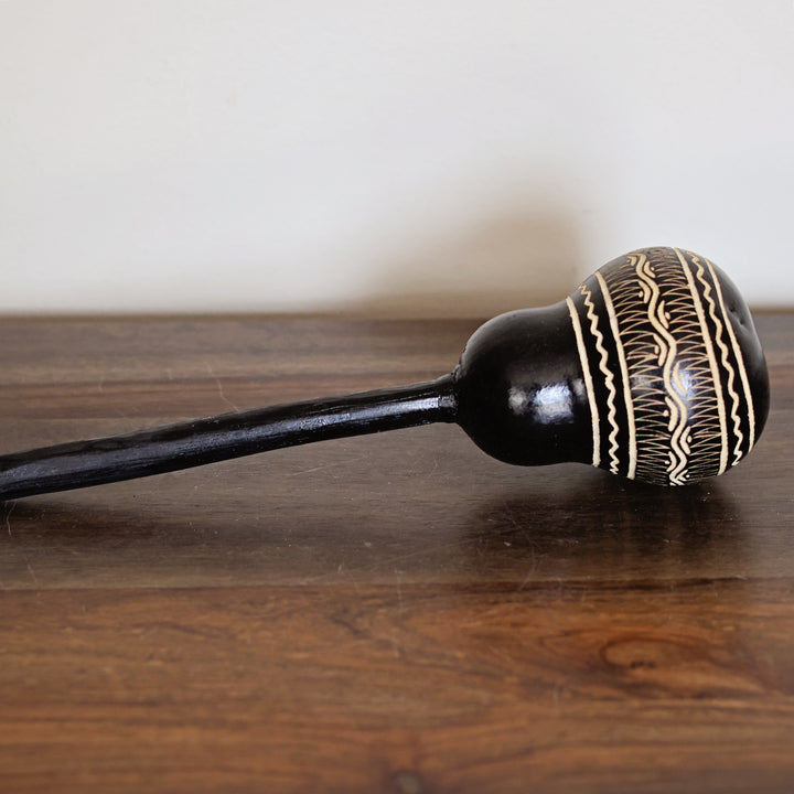 Black hand-carved gourd maraca handmade in Kenya by fair trade artisans