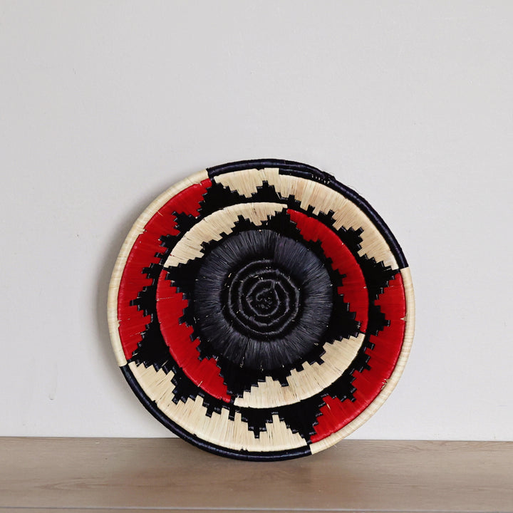 Handwoven Black, Red & Natural Bukedo and Raffia bowl handmade in Uganda with bold geometric patterns for fair trade home décor.