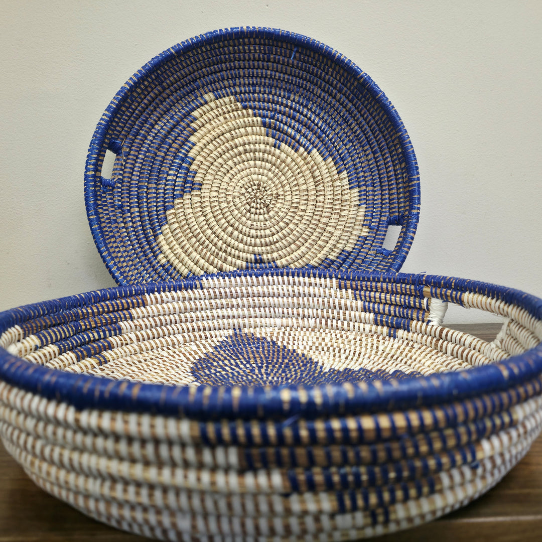 Handwoven blue and white sweet grass bowl with natural texture, artisan made for home décor.