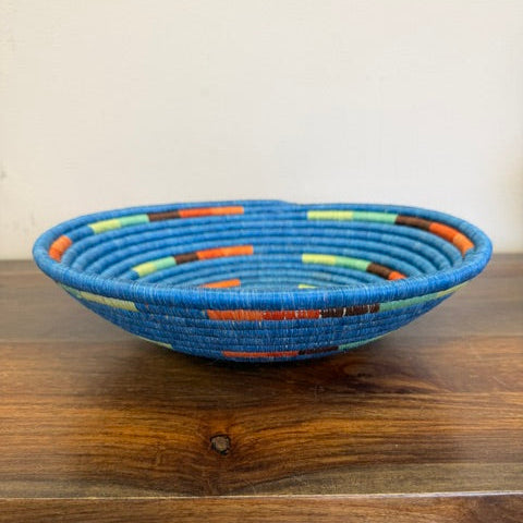 Side view of the Blue Mosaic Rwanda sisal basket handcrafted by fair trade artisans using sustainable sisal fibers.