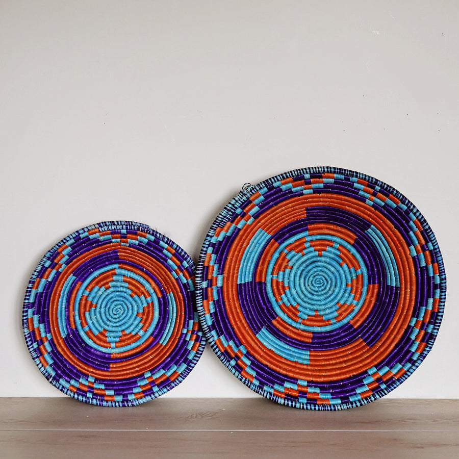 Handwoven Blue, Turquoise & Red Bukedo and Raffia bowl handmade in Uganda with colorful geometric patterns for fair trade home décor.