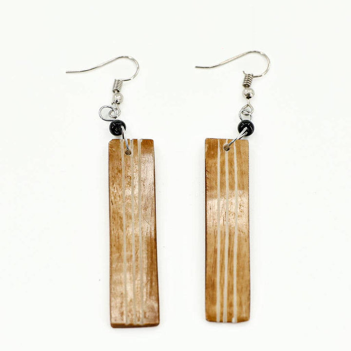 tan bone earrings in rectangle shape on a fish hook