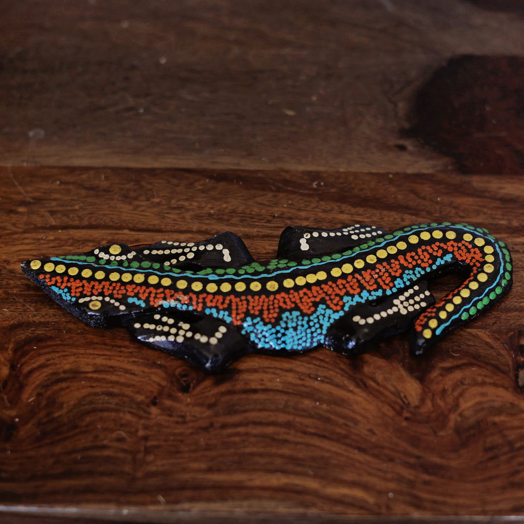 Assorted hand painted geckos in vibrant colors for artisan home decor
