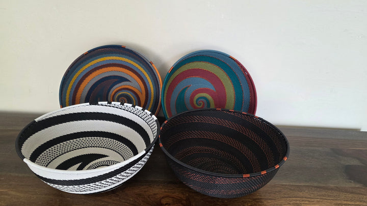 Colorful Zulu wire bowl featuring intricate geometric weaving handcrafted by artisans.