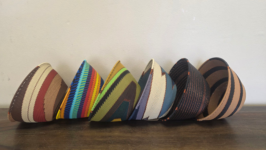 Colorful Zulu wire deep basket featuring intricate geometric woven design; handmade in South Africa.
