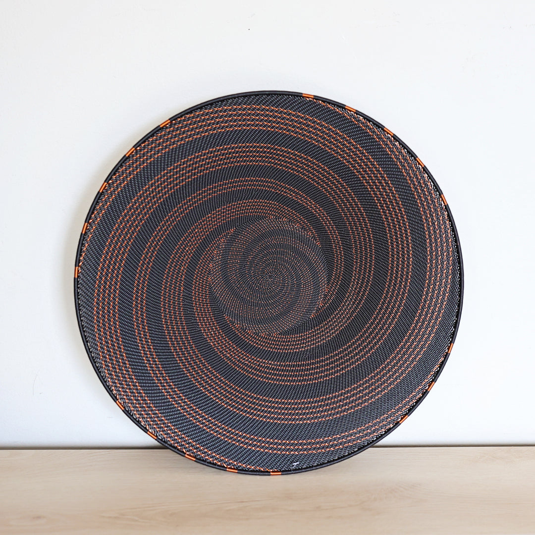 Copper & Black Zulu Extra Large Shallow Basket handwoven in South Africa with a rich black base and shimmering bare copper wire accents.