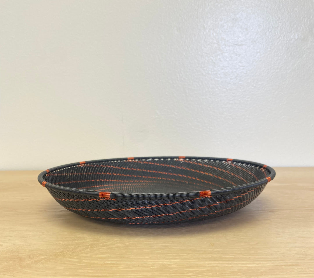 Large tray  Zulu wire basket handwoven in black with subtle warm copper spiral accents.