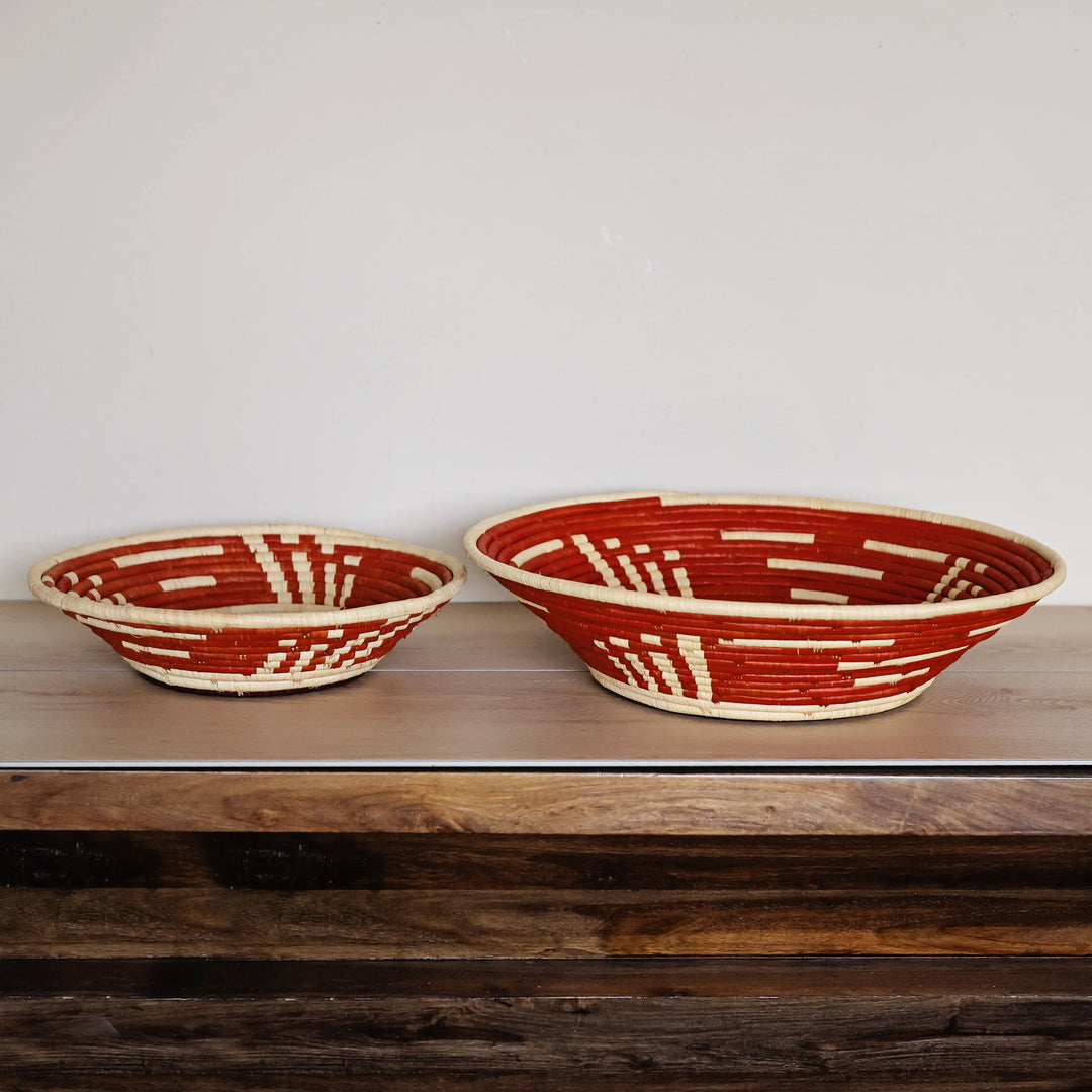 Side view of a Copper Horizon Bukedo and Raffia bowl handcrafted in Uganda from banana leaf stalks and palm raffia in warm copper and natural tones.