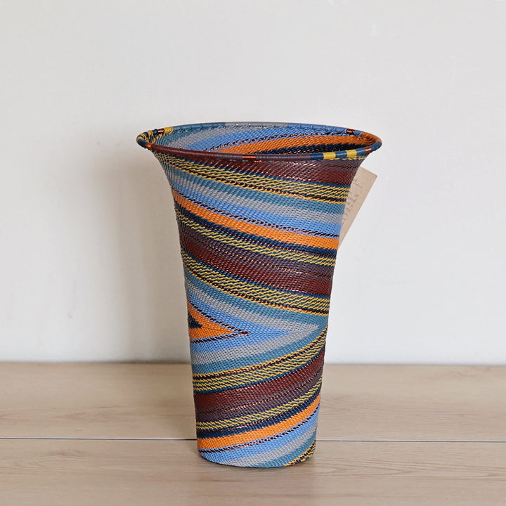Cove Zulu Wire Flared Top Vase handwoven in South Africa with intricate woven patterns in layered coastal and earthy tones.
