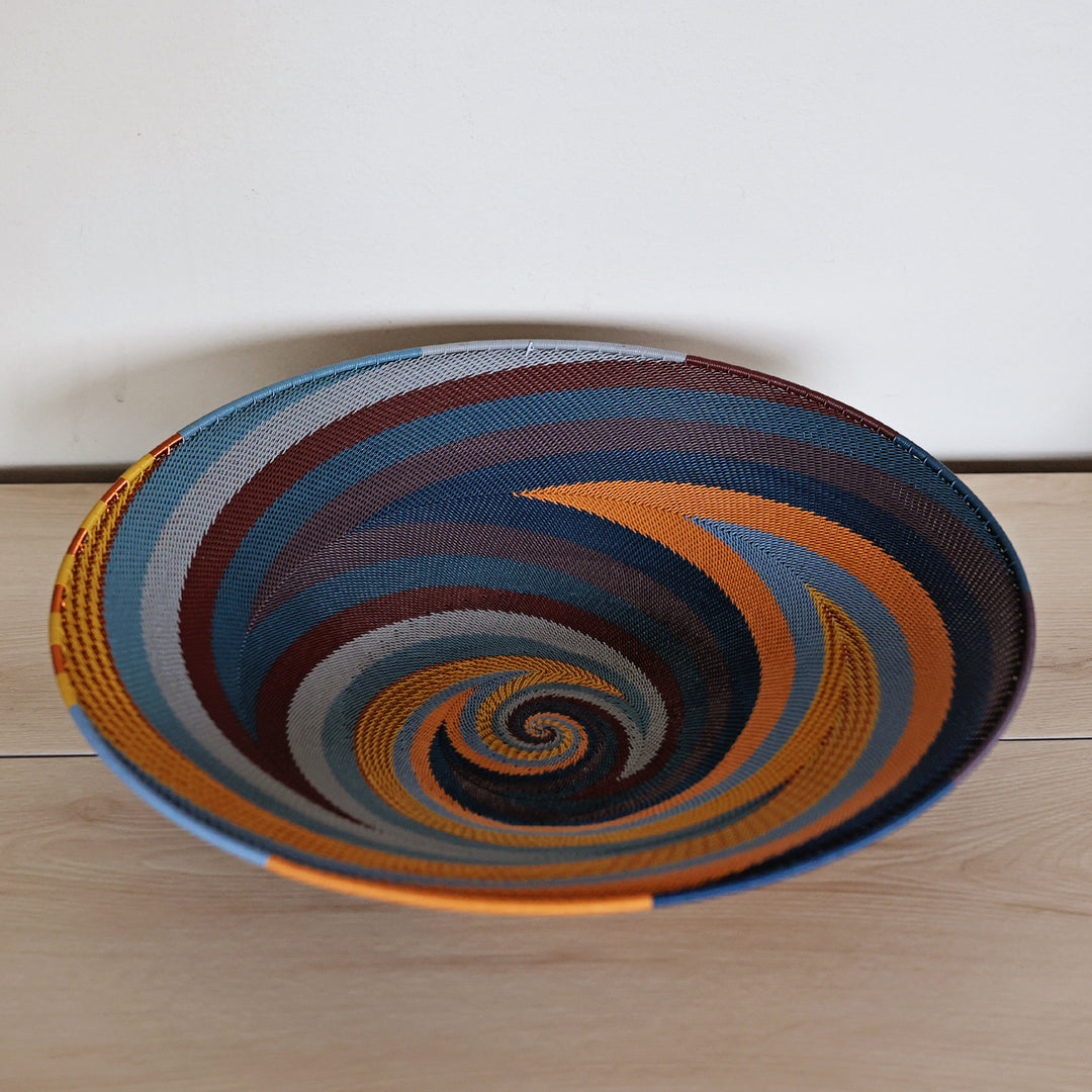 Cove Zulu Wire Shallow Baskets handwoven in South Africa with intricate woven patterns in layered coastal and earthy tones.
