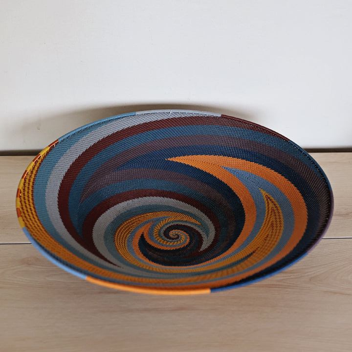 Cove Zulu Wire Shallow Baskets handwoven in South Africa with intricate woven patterns in layered coastal and earthy tones.