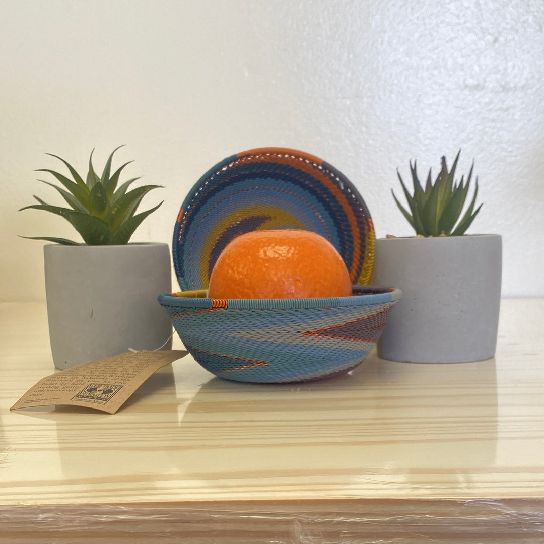 Cove Zulu Wire Small Wide Bowl handwoven in South Africa with intricate woven patterns in layered coastal and earthy tones.