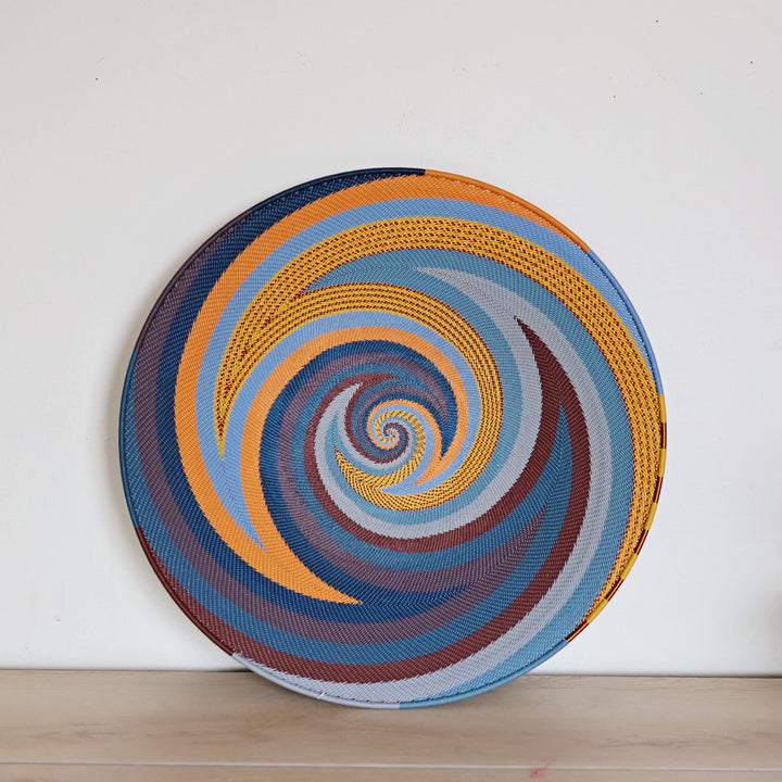 Cove Zulu Wire trays handwoven in South Africa with intricate woven patterns in layered coastal and earthy tones.