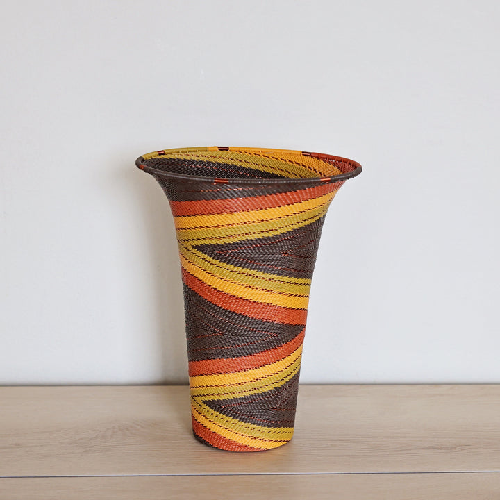 Dark Earth Zulu Flared Top Vase handwoven in South Africa with rich brown, rust, golden yellow, and olive tones.