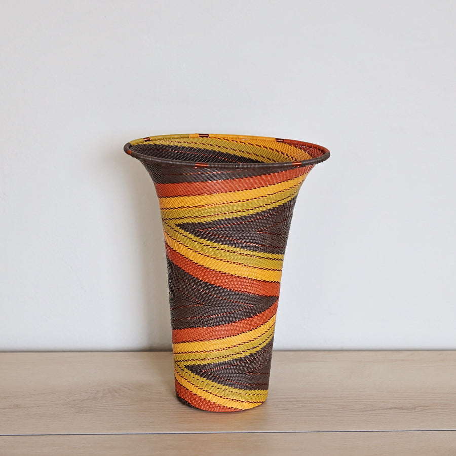 Dark Earth Zulu Flared Top Vase handwoven in South Africa with rich brown, rust, golden yellow, and olive tones.
