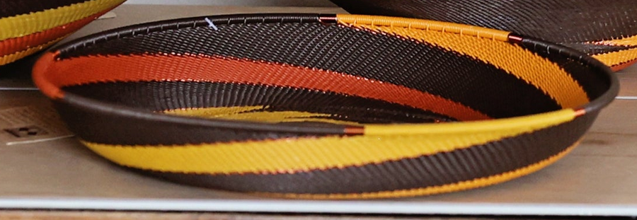 Dark Earth Zulu Large Tray handwoven in South Africa with rich brown, rust, golden yellow, and olive tones.