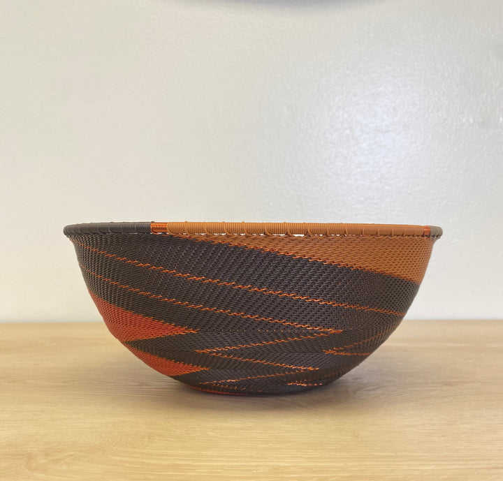Artisan-made Dark Earth Zulu extra large wire basket handwoven in South Africa in warm brown, orange, rust and ochre tones.
