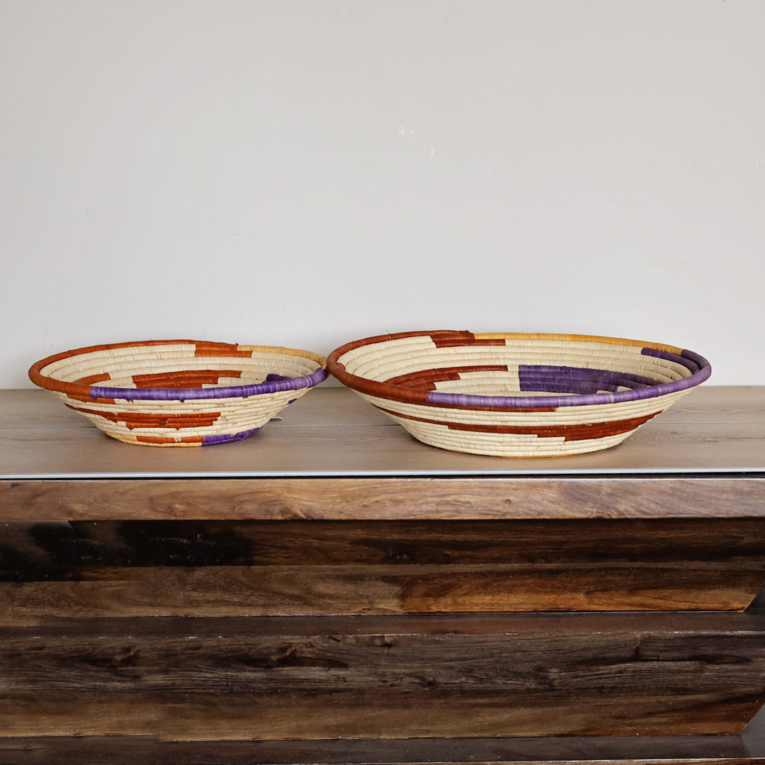 Side view of a Desert Spiral Bukedo and Raffia bowl handcrafted in Uganda from banana leaf stalks and palm raffia.