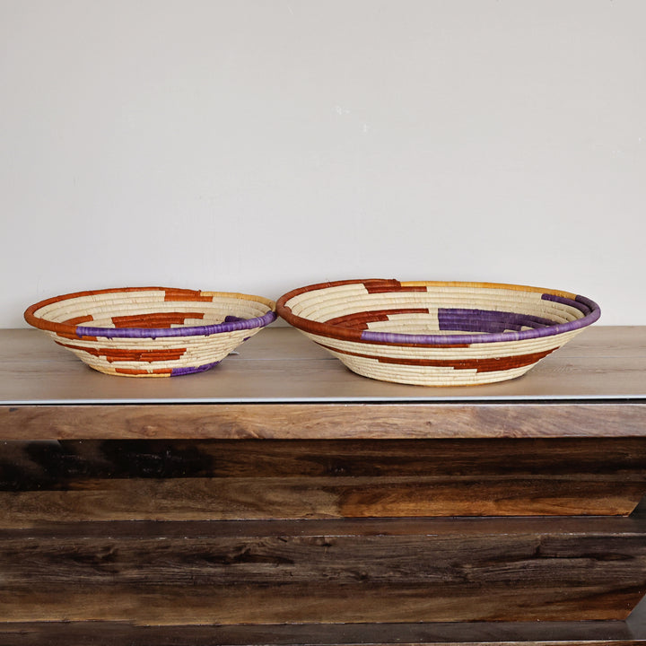Side view of a Desert Spiral Bukedo and Raffia bowl handcrafted in Uganda from banana leaf stalks and palm raffia.