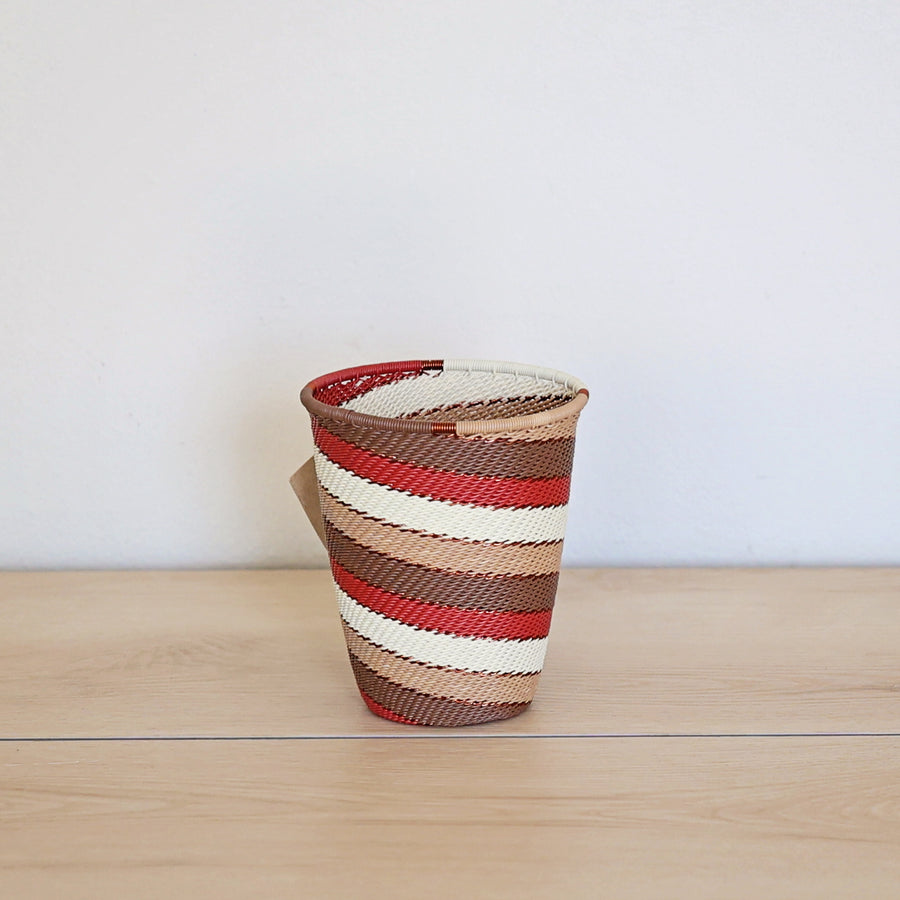 Desert Zulu Wide Base Cup handwoven in South Africa with ivory, rust, brown, and warm neutral tones.