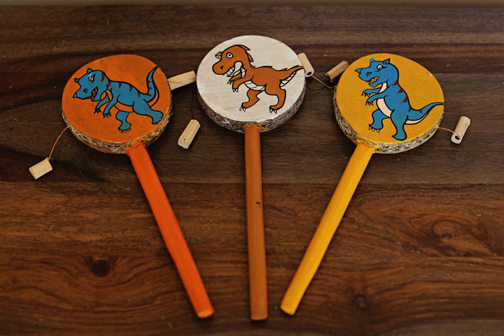 Fair trade tic toc kids toy with hand-painted dinosaur design on each side, made in Africa