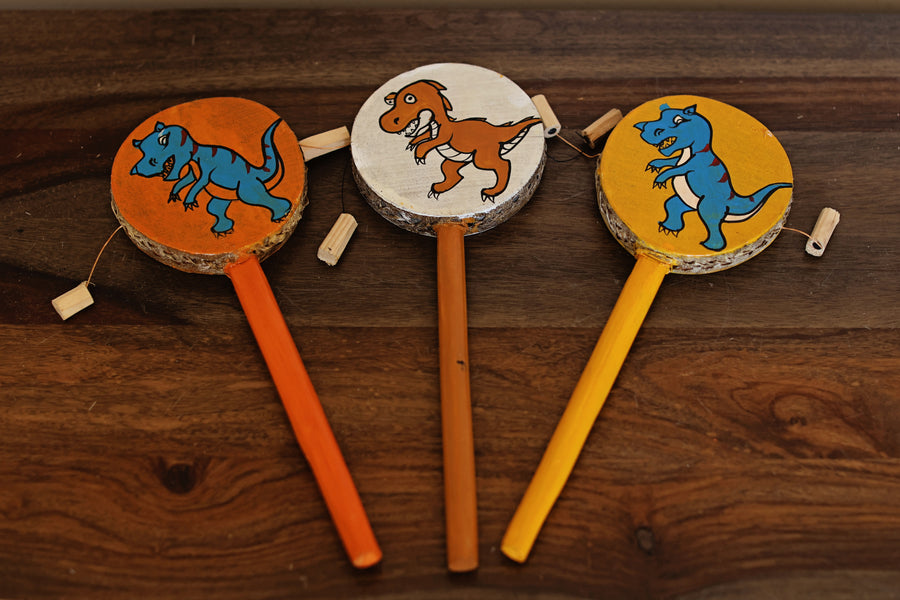 Fair trade tic toc kids toy with hand-painted dinosaur design on each side, made in Africa