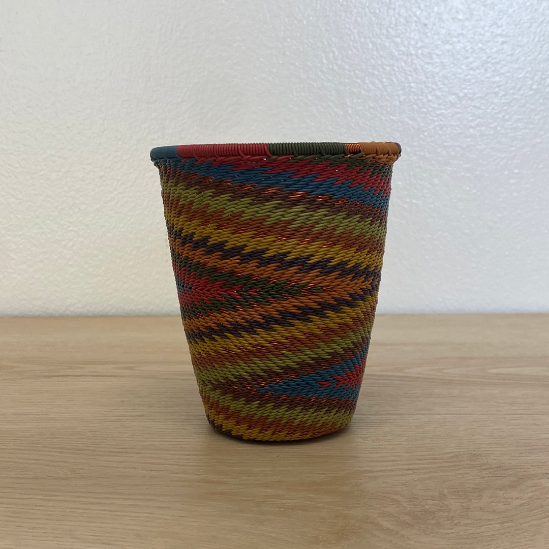 Earthy Rainbow Zulu wire cup handwoven in rich rust, mustard, blue, olive and brown tones.