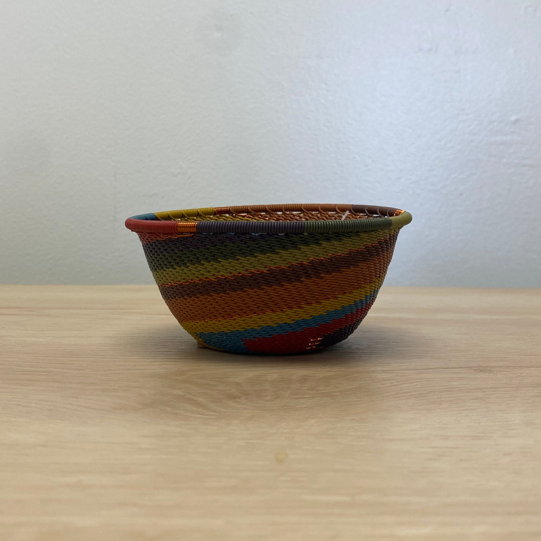 South African Zulu wire small bowl handwoven in a warm Earthy Rainbow spiral pattern.