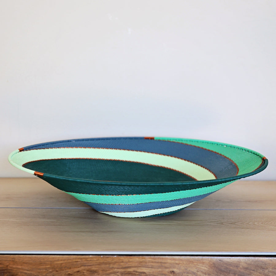 Emerald Zulu Extra Large Shallow Basket handwoven in South Africa with emerald and soft mint diagonal stripes.