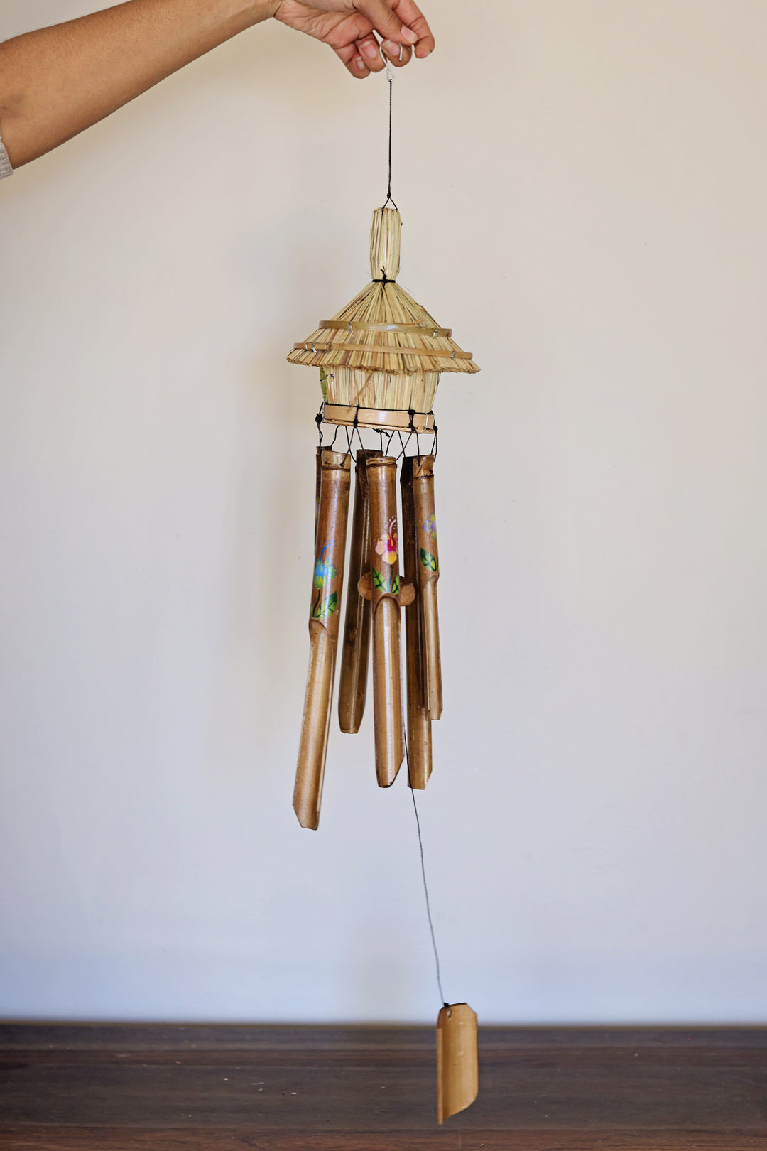 Fair trade bamboo wind chime handmade with colorful flower design for garden decor