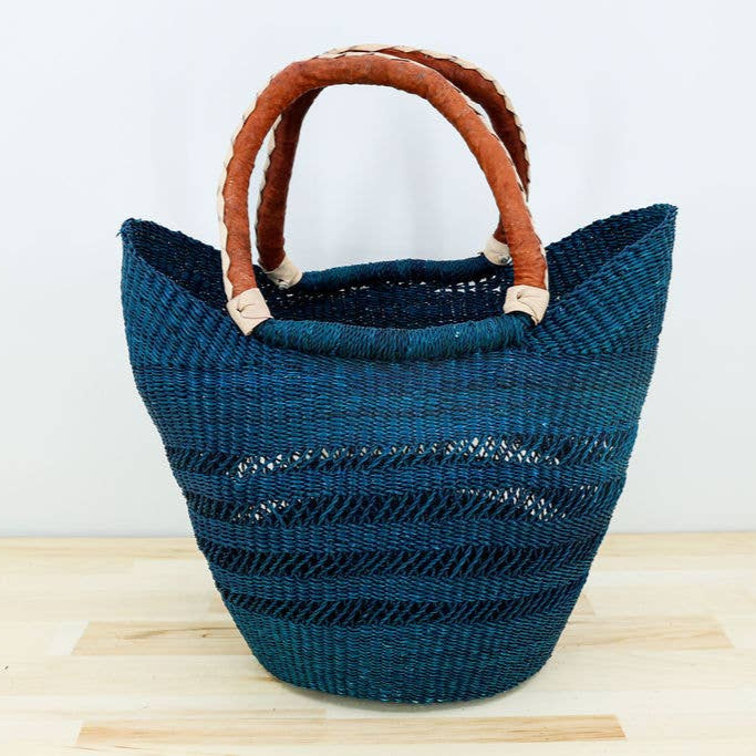 Fair trade grocery tote with sturdy leather handle and airy weave.