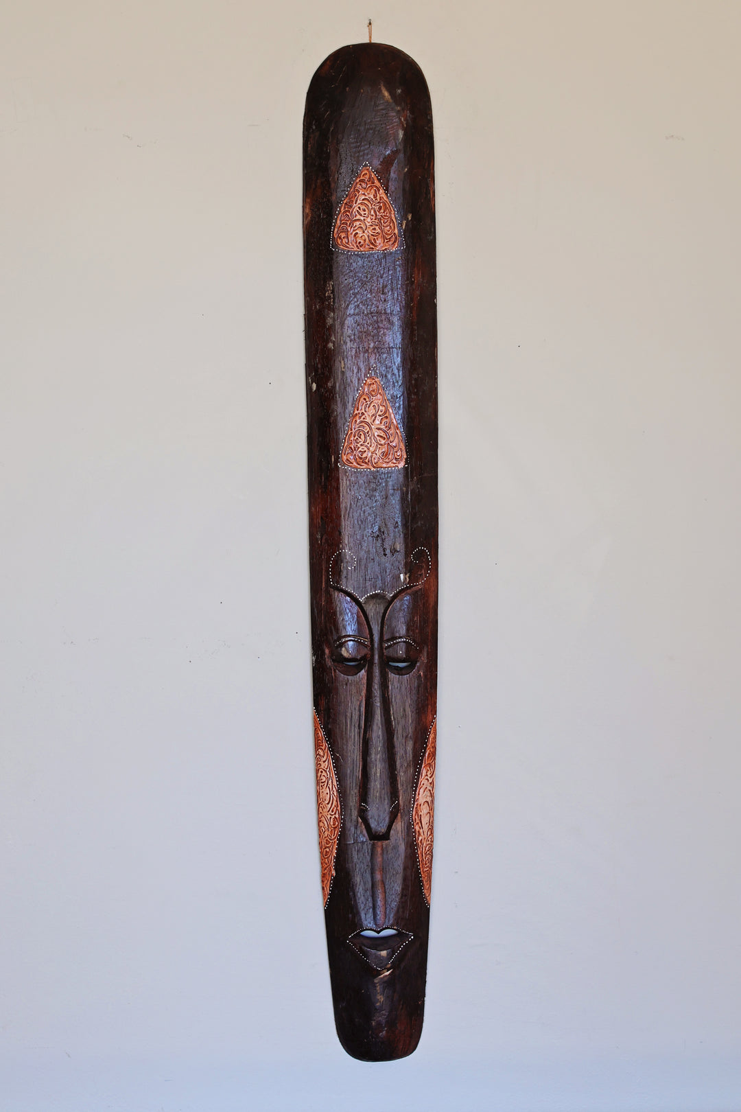 African mask with bold rainbow dots in bright hand painted colors