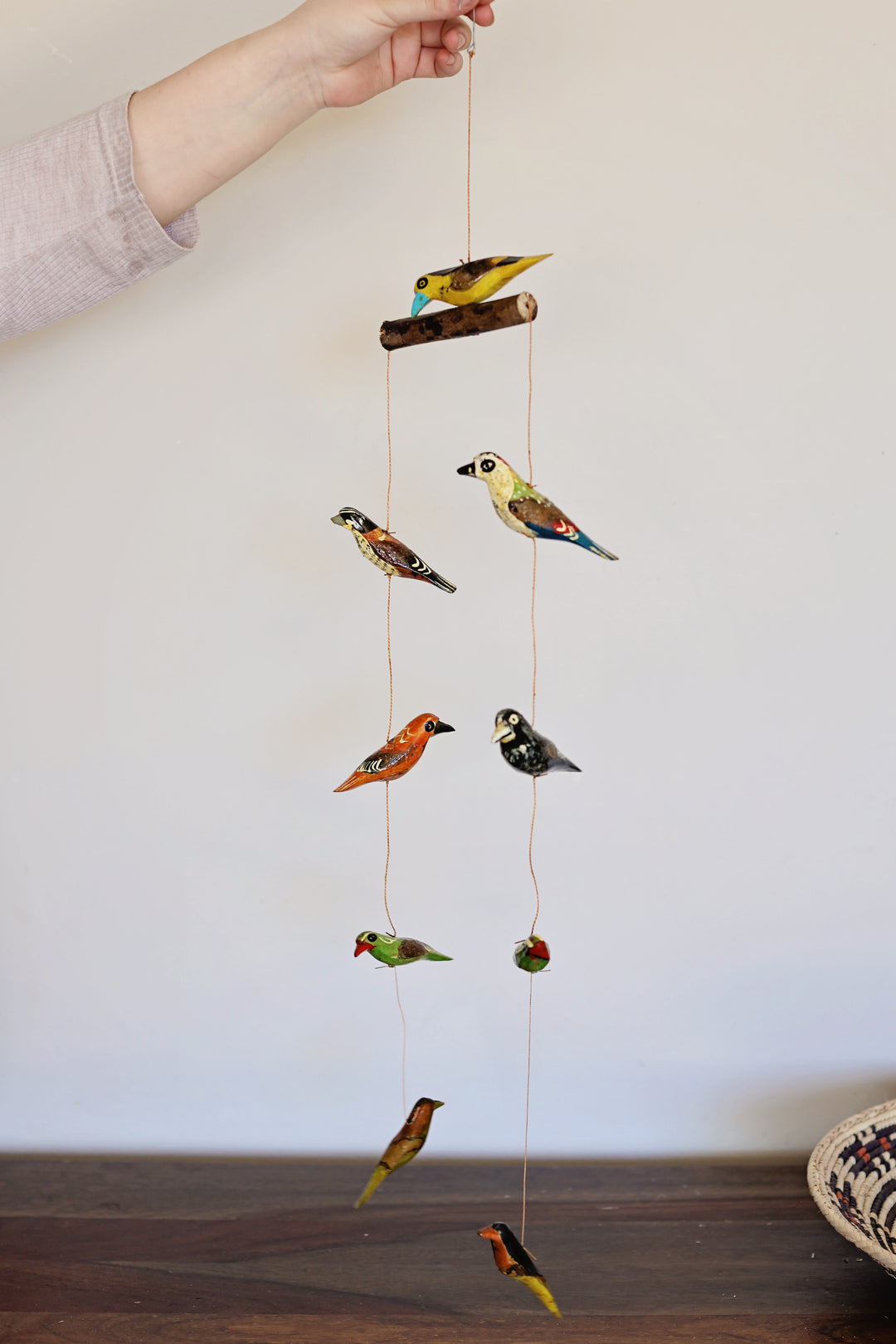 Handmade 9-bird wooden mobile with colorful painted birds in circular design