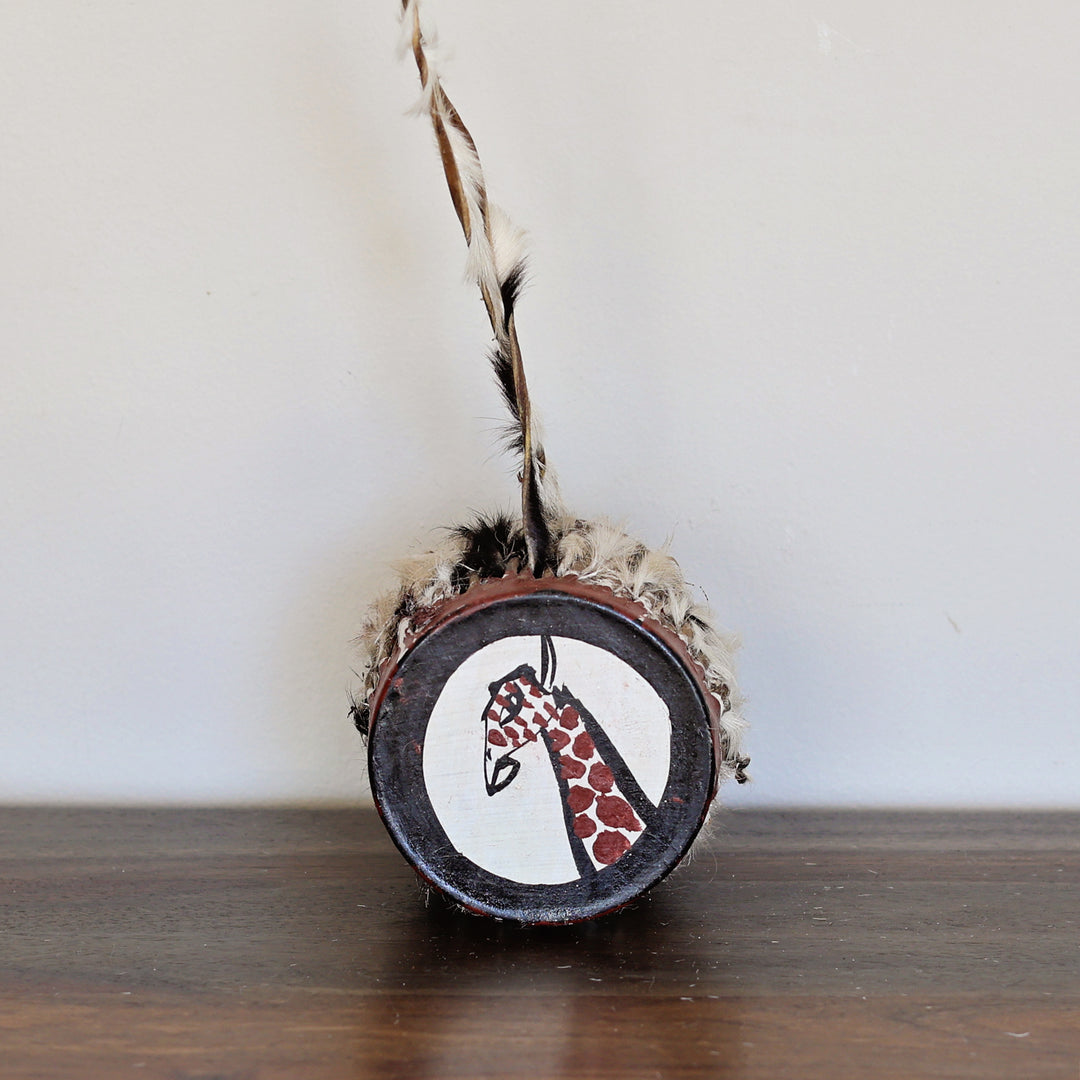 Fair trade wooden drum with goat skin and a giraffe head hand-painted on top, handmade in Kenya