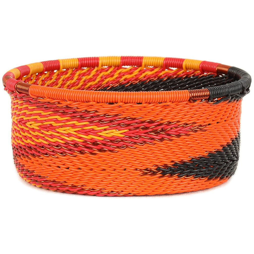 Handwoven Zulu Wire Tuna Cup Baskets in Fire from South Africa in a variety of colorful and neutral artisan patterns.