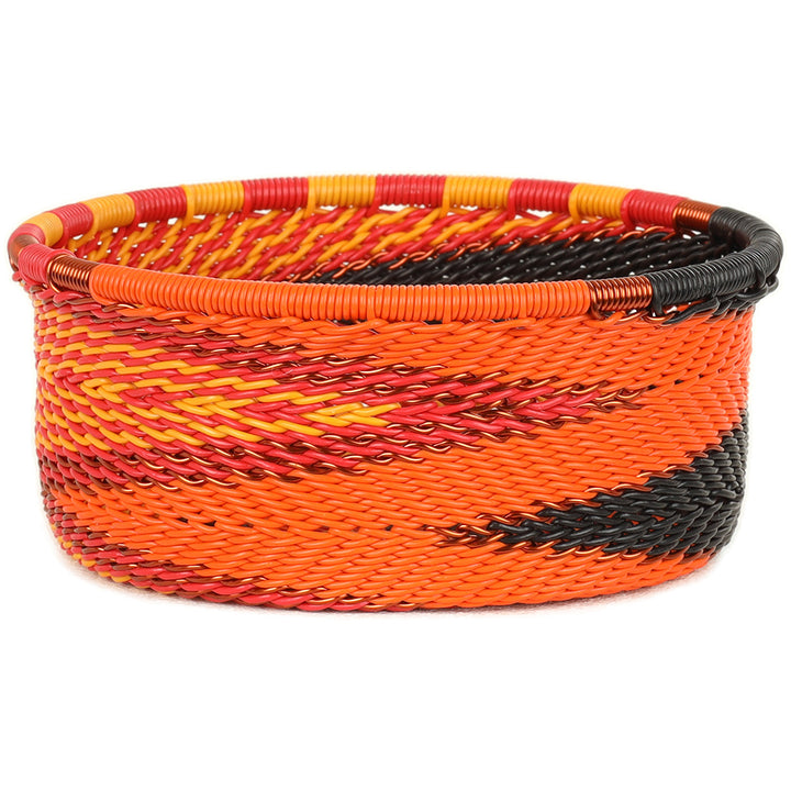 Handwoven Zulu Wire Tuna Cup Baskets in Fire from South Africa in a variety of colorful and neutral artisan patterns.