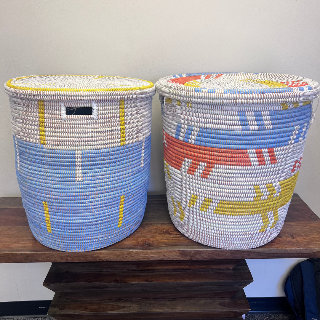 Side angle of handwoven flat-lid laundry hamper highlighting its shape and structure.