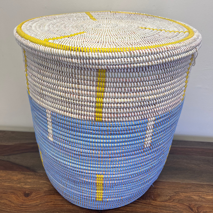 Close-up detail of sweet grass weaving on flat-lidded laundry hamper.”