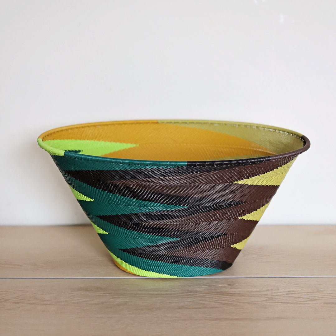 Forest Zulu Wire Large Funnel Bowl handwoven in South Africa in green, yellow, brown, and black.