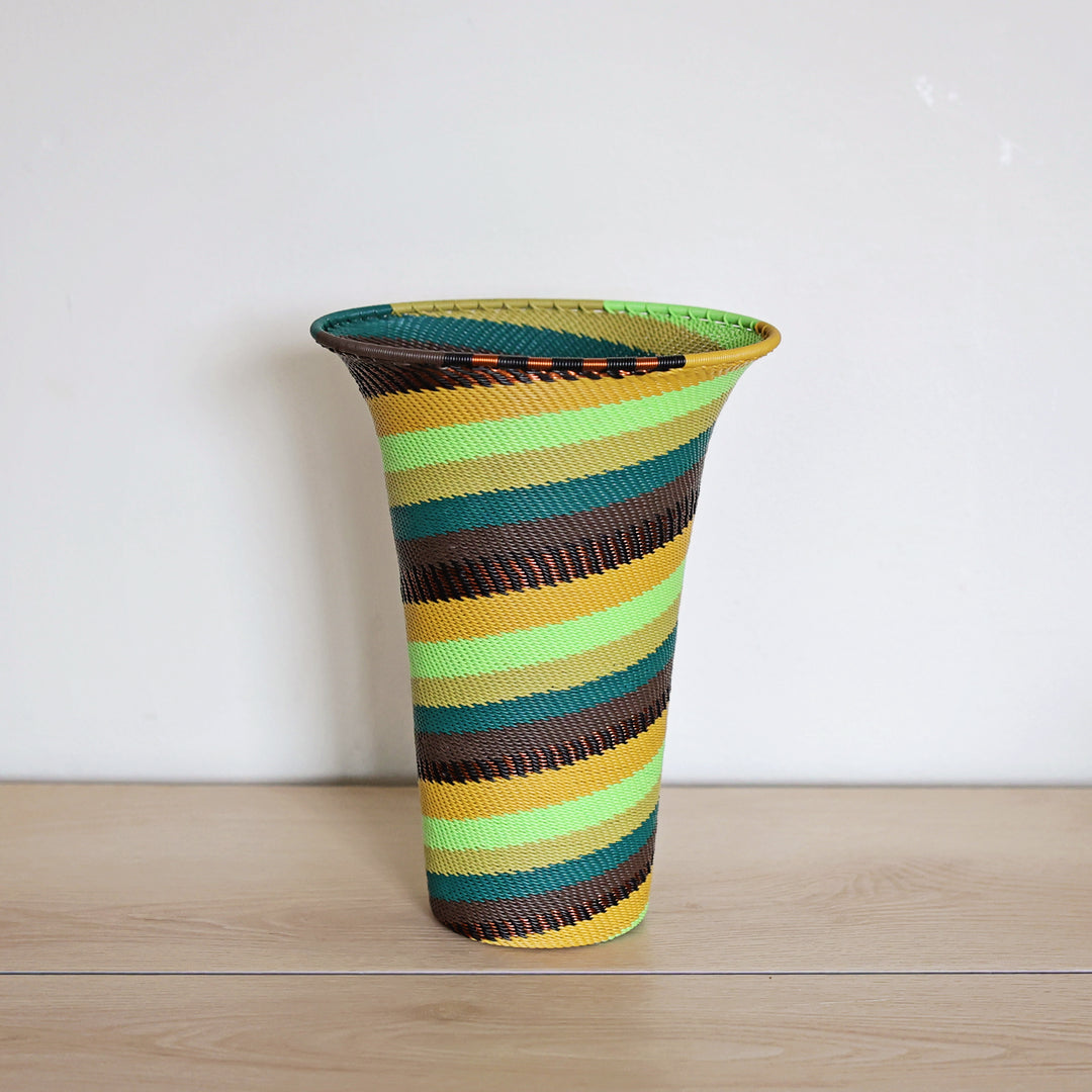 Handwoven Forest Zulu Wire Vase with layered forest green and golden yellow patterns.